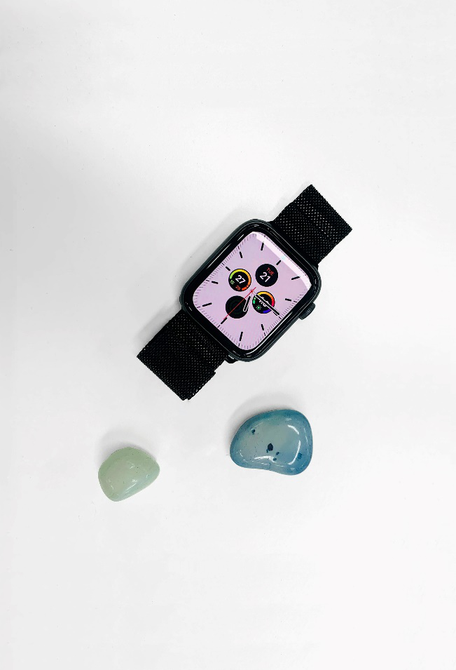 an apple watch placed on a white surface