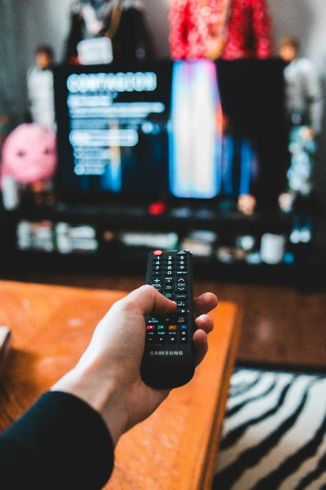 a person holding a remote control