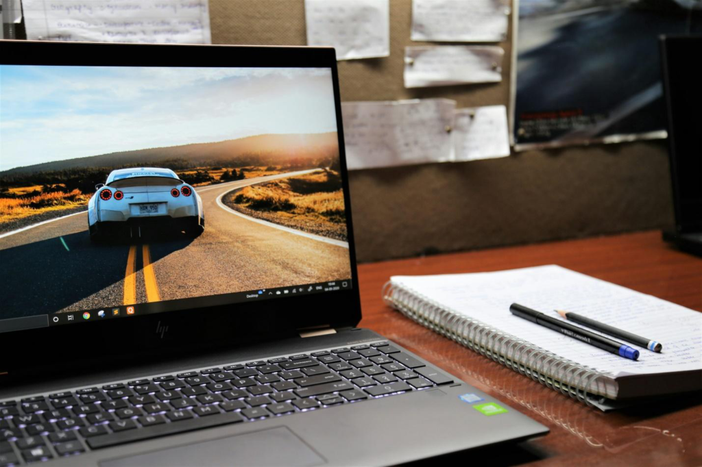 a laptop open to display a picture of a car