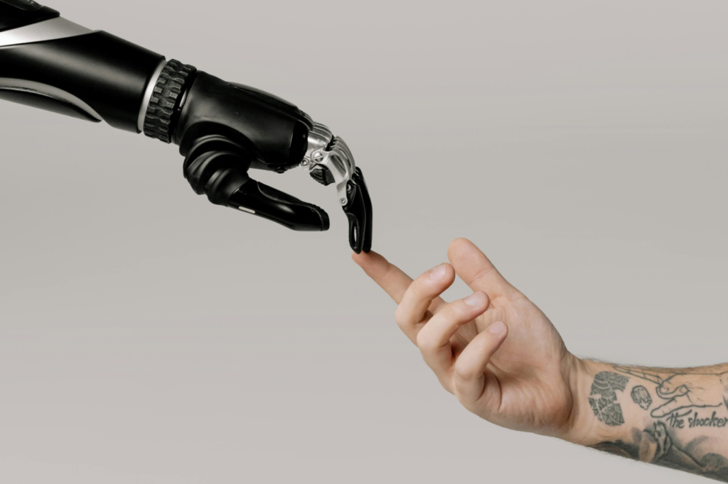 A robotic hand and a human hand