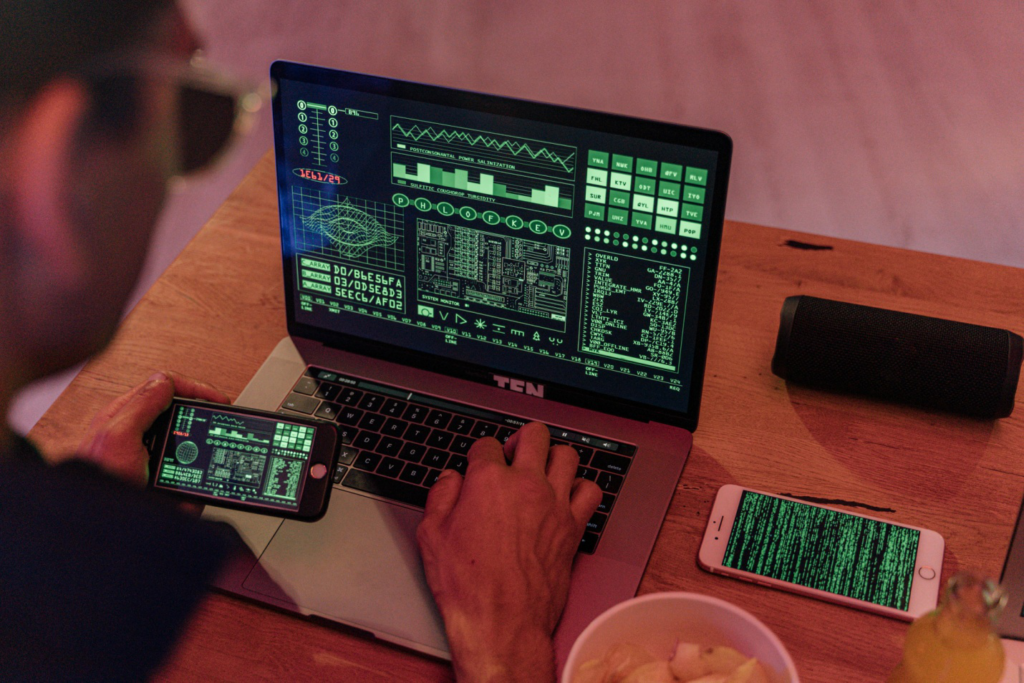 A person working on multiple screens